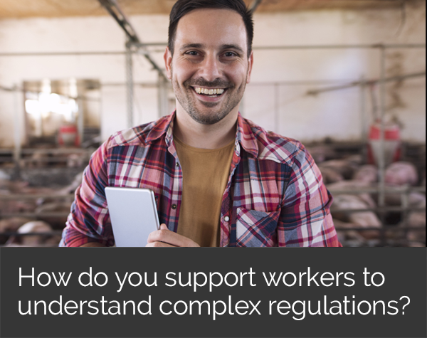 Complex regulations image - farm worker smiling with ipad under arm